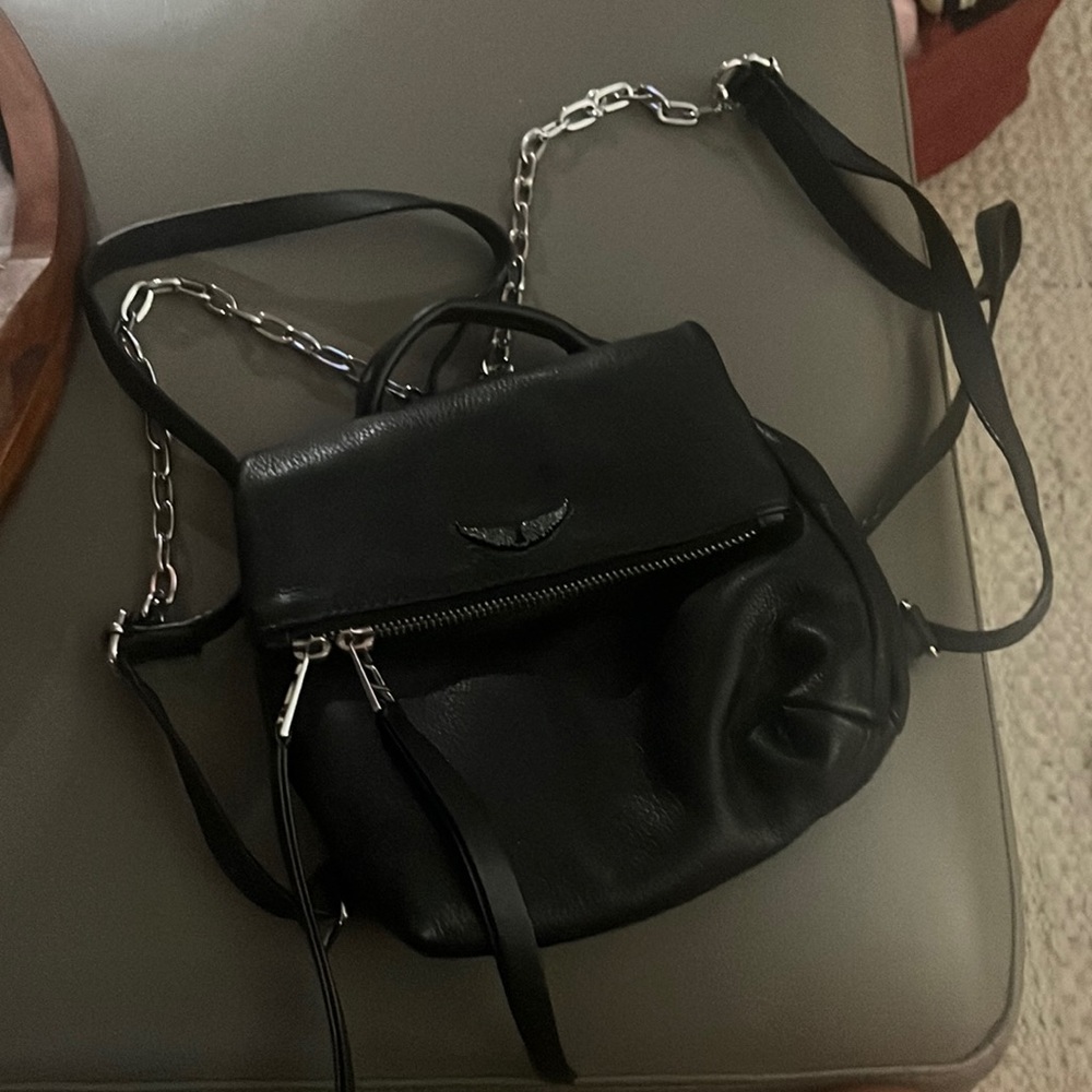 Black leather back pack , like new